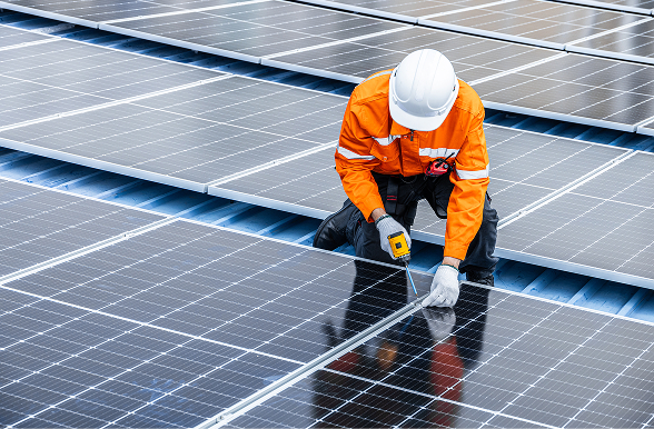 Worker installing solar panels.
