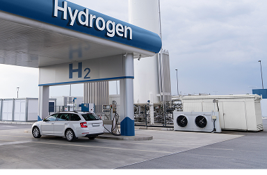Concept image of a car at a hydrogen fuel cell station.