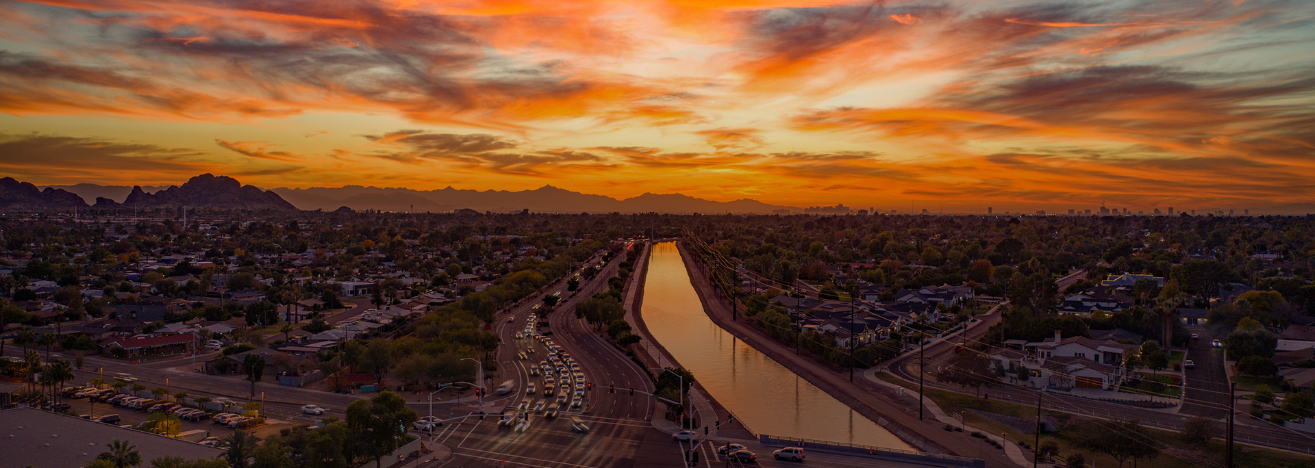 Canal in the desert at sunset.